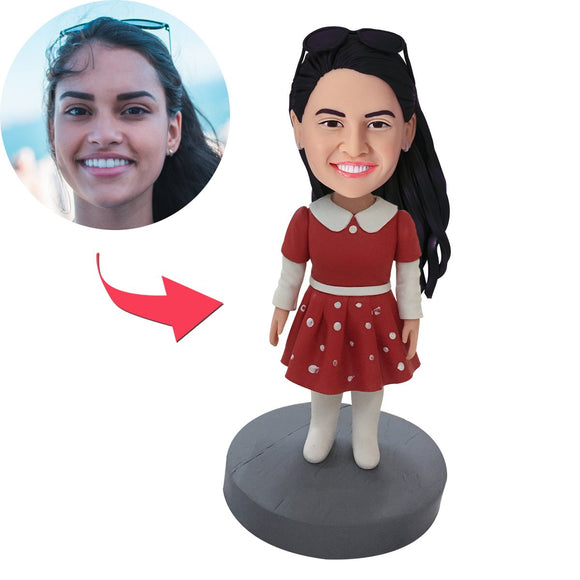 Custom Bobblehead little girl in a custom-made red dress with embossed text