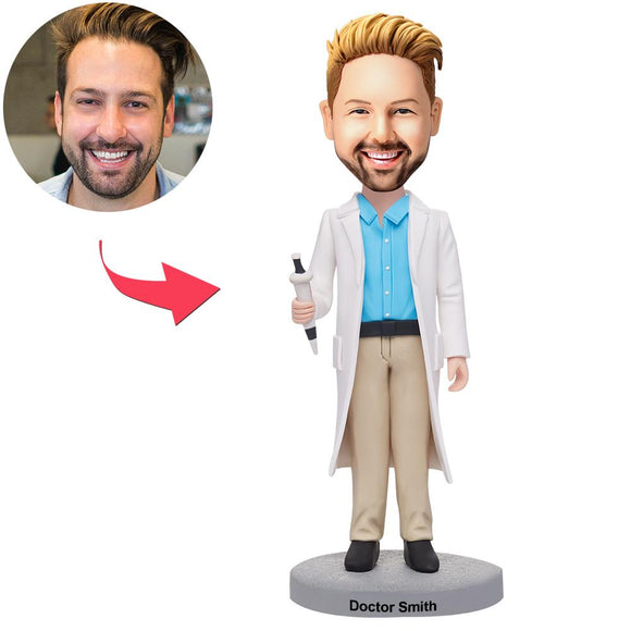 Male doctor holding a custom syringe Bobblehead with text engraved